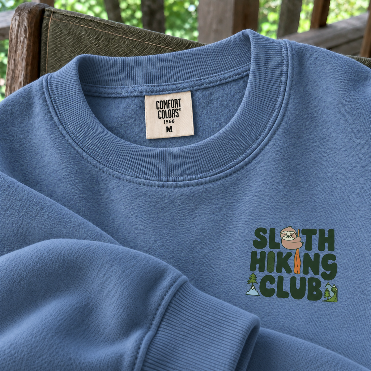Blue Jean Sloth Hiking Club fleece sweatshirt detail with Comfort Colors 1566 neck label and ribbed cuff