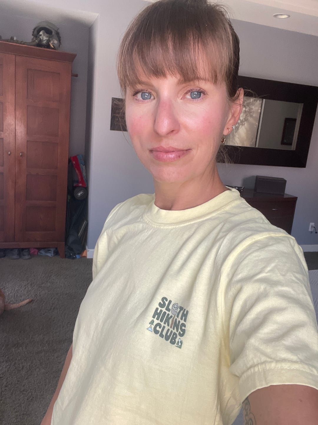 Sarah wearing her yellow Sloth Hiking Club Comfort Colors tee in size S